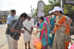 Demonstration on hygiene and hand washing at Balanagar Bus Stop.